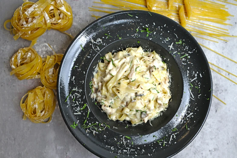 a plate with macaroni salad and a side of vegetables