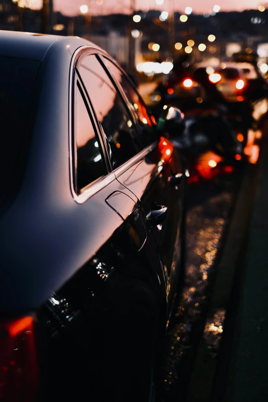 a parking lot filled with lots of cars at night