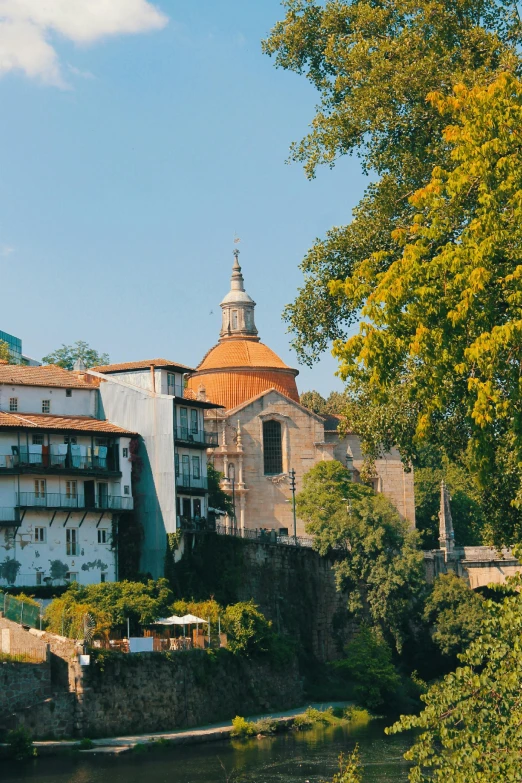 a view of several buildings next to some water