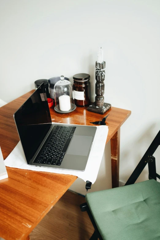 the open laptop is sitting on the chair