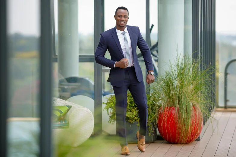 an image of man standing outside in suit