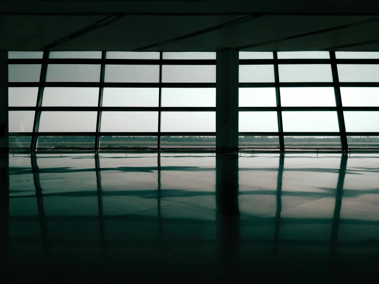 an airplane wing through the air through some windows