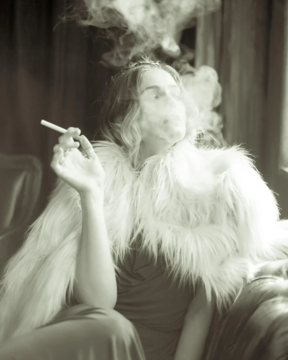 a woman in a feather coat smoking and looking at the camera