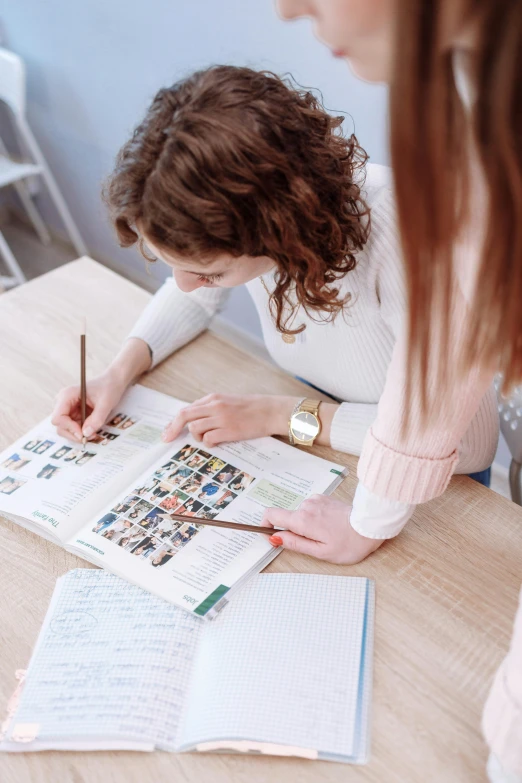 a woman taking notes and getting ready to take the test