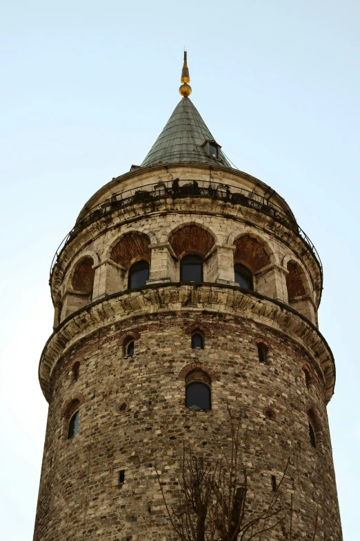 a stone tower with a sky background