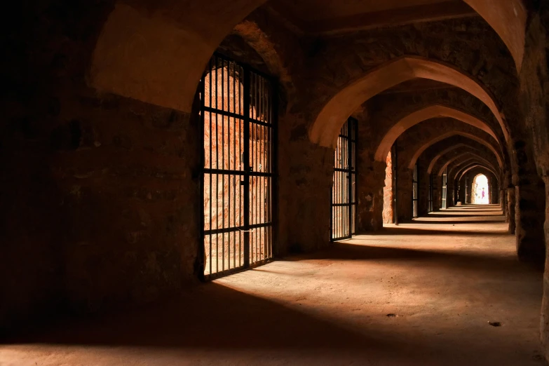 a long stone tunnel with a bunch of windows