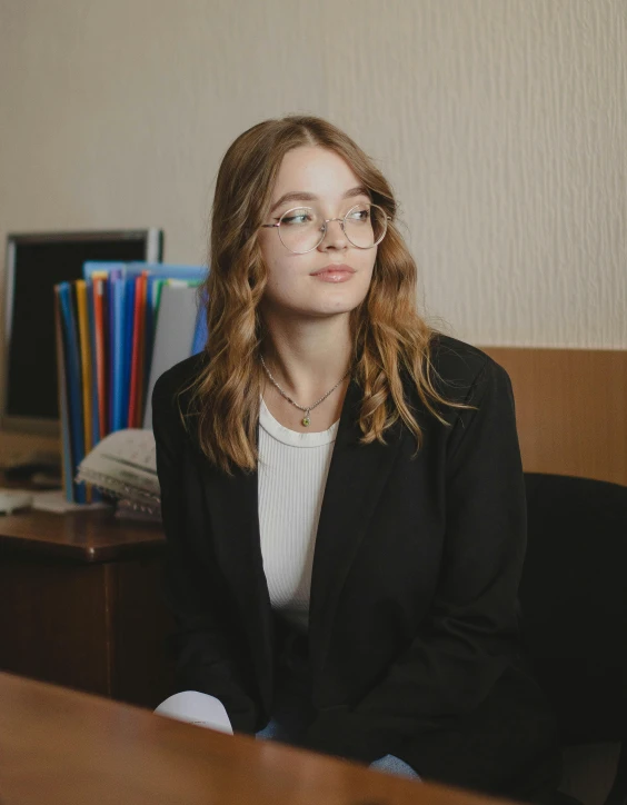 an image of a woman sitting at her desk