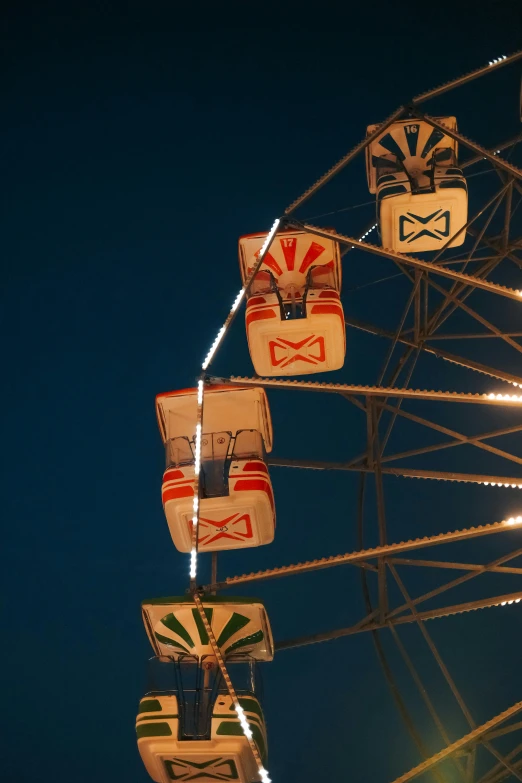 a ferris wheel lit up in the night sky