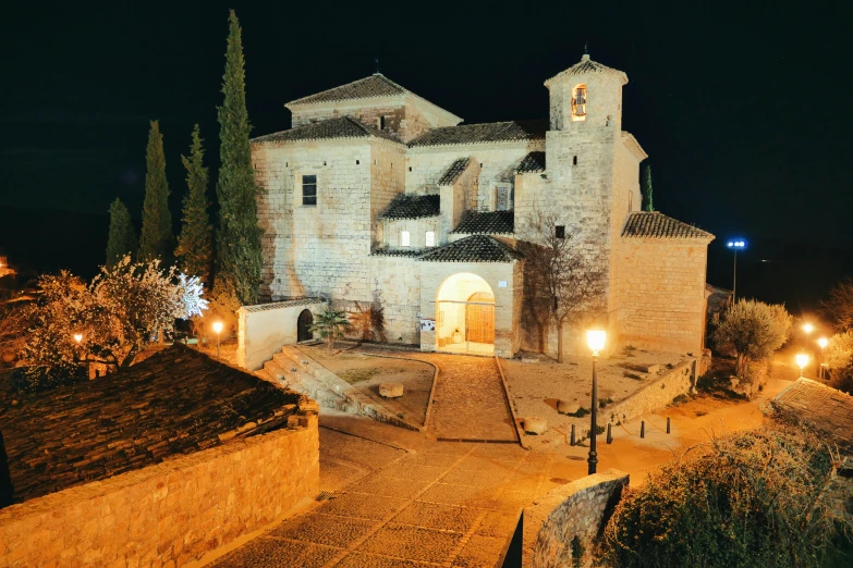 a small church in the middle of a cobblestone street