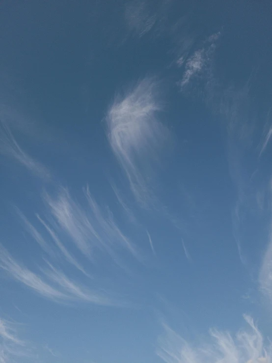 a person on a surf board under some blue skies