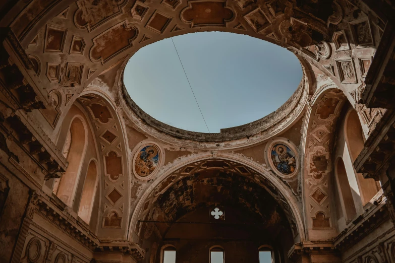 a building with several ceiling designs and columns