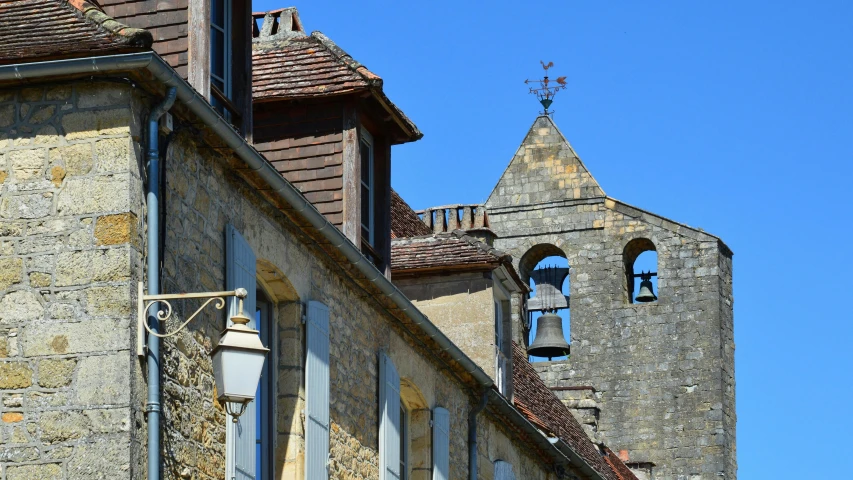 two tall buildings with towers and bells at the top of them