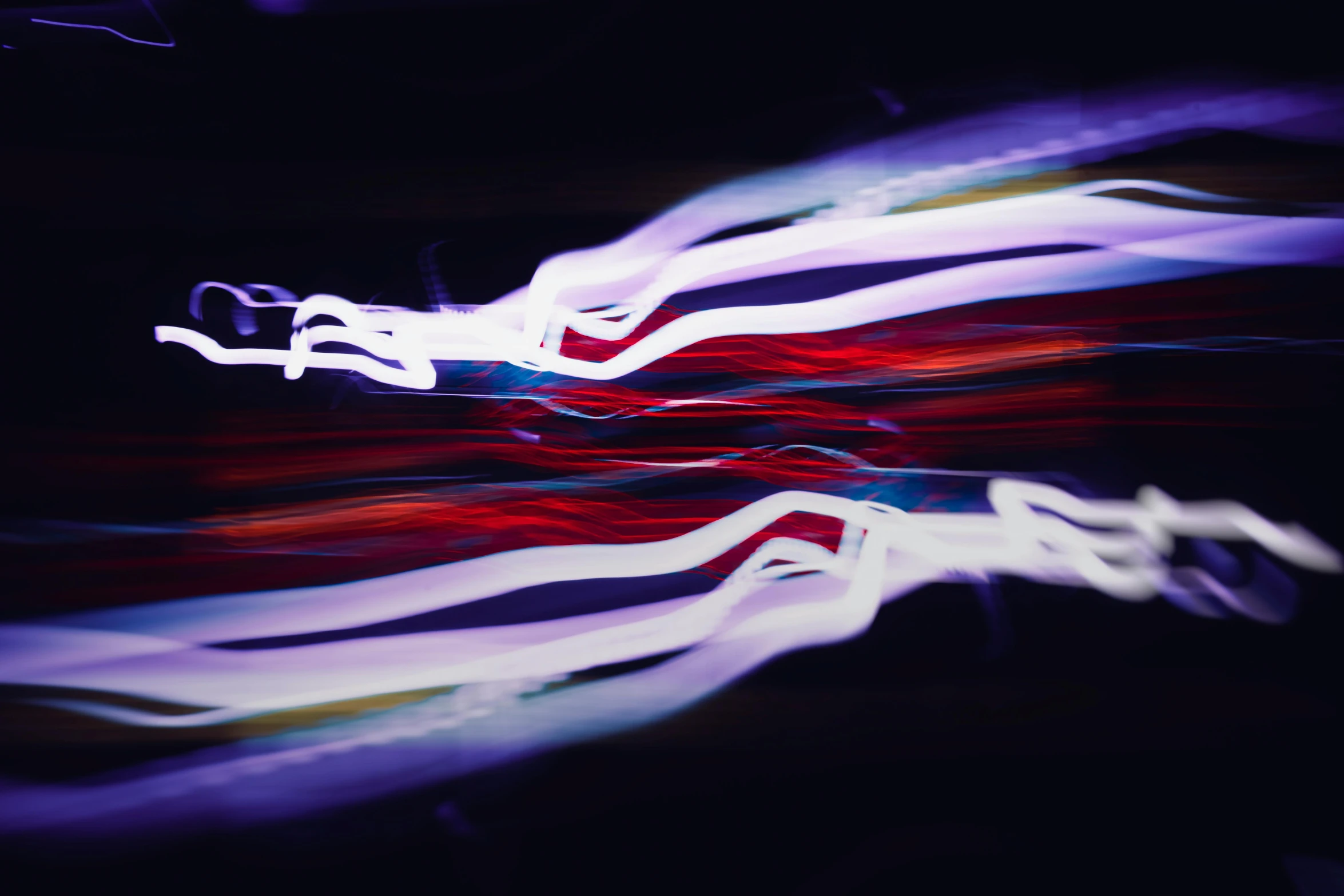 abstract blurry image of red, white and blue lines in motion