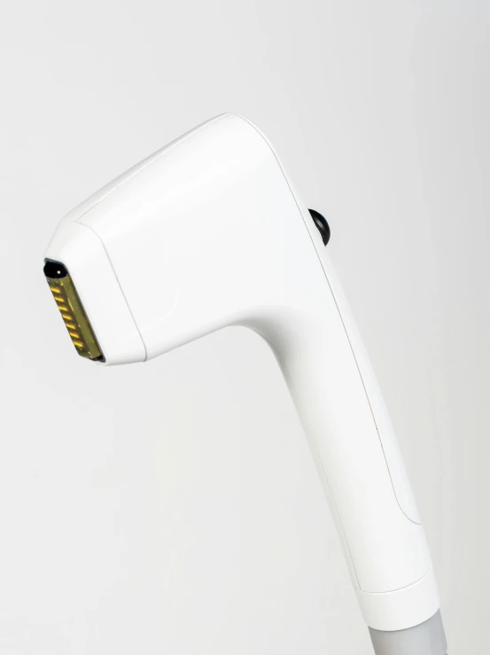 an electric hair dryer sitting up against a white background