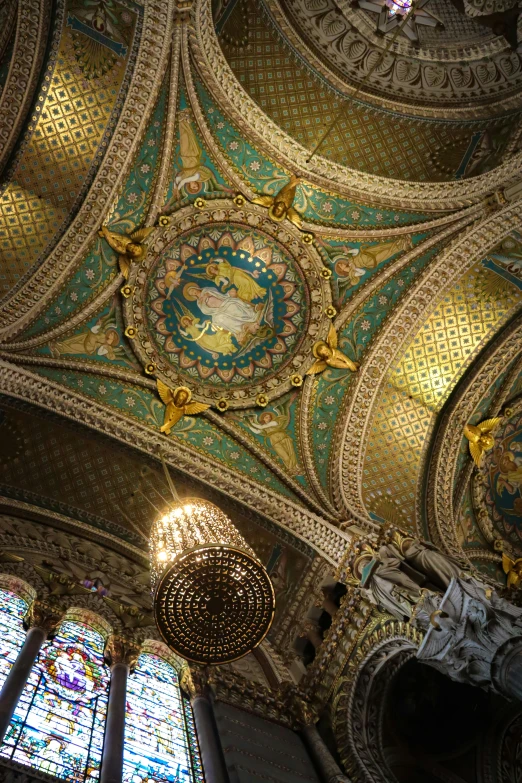 an intricately painted ceiling and chandelier in the dome room of a church