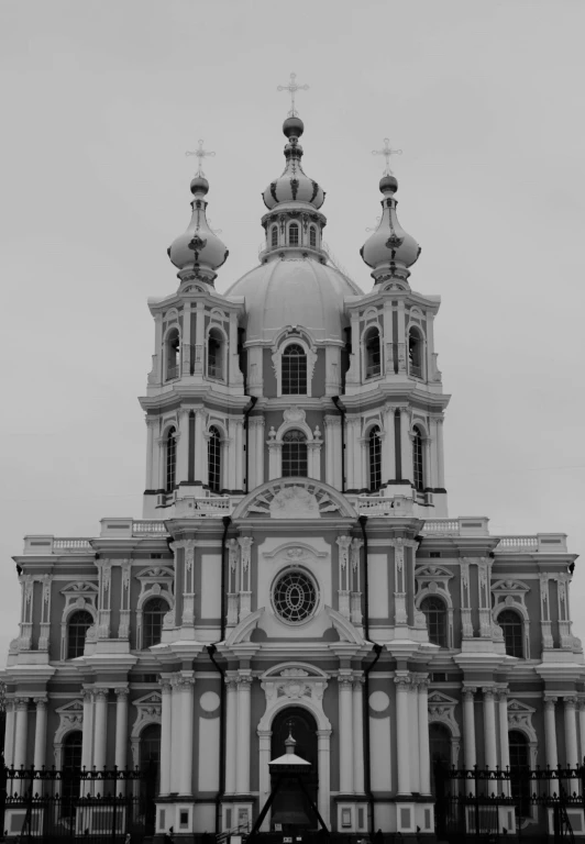 the clock tower on top of a church that is white