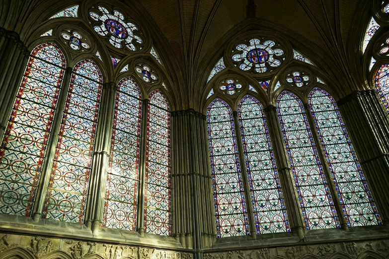 three massive stained glass windows are seen in this church