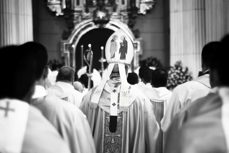 a man dressed in priest robes during a mass