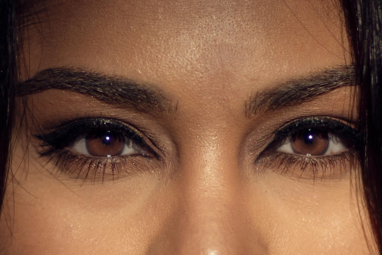 a close up of a woman with false lashes