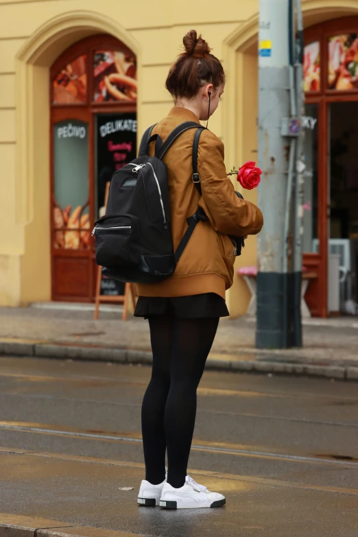 a person riding on a skateboard down a street