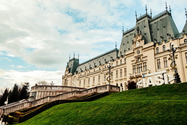 a very big pretty building on the side of a hill