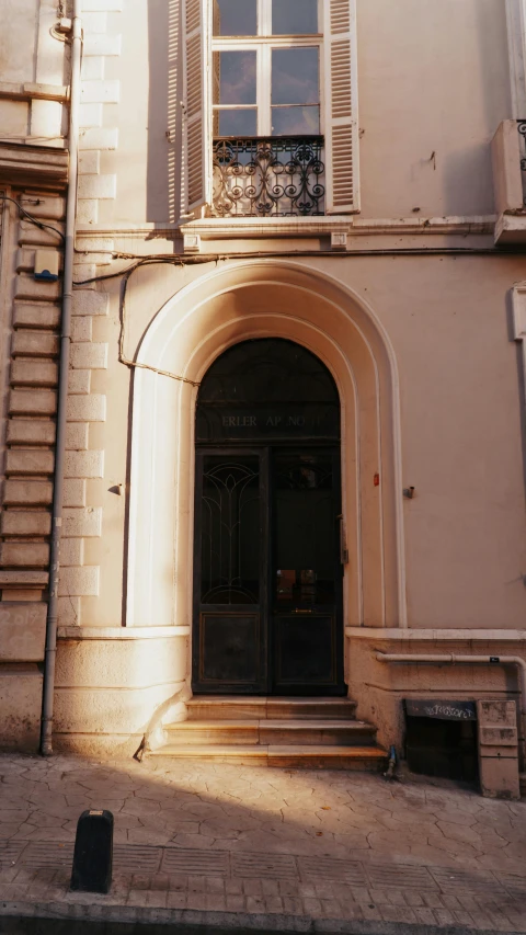 an entrance and steps on an old building