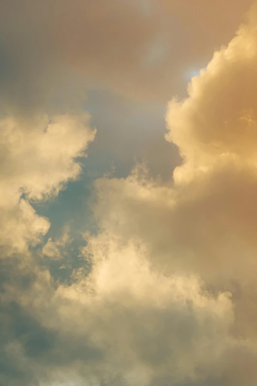 a airplane is flying through the cloudy sky