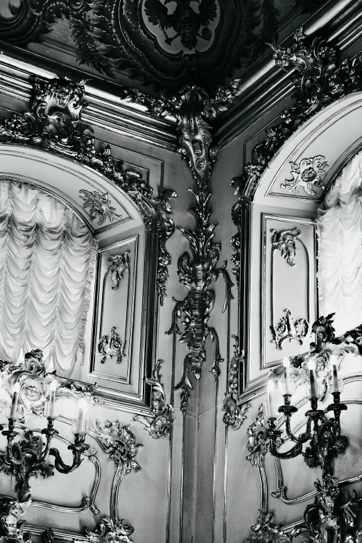 a fancyly decorated room with ornate mirrors and lighting