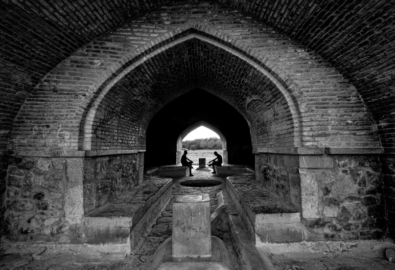 an entrance to a building with a man in black