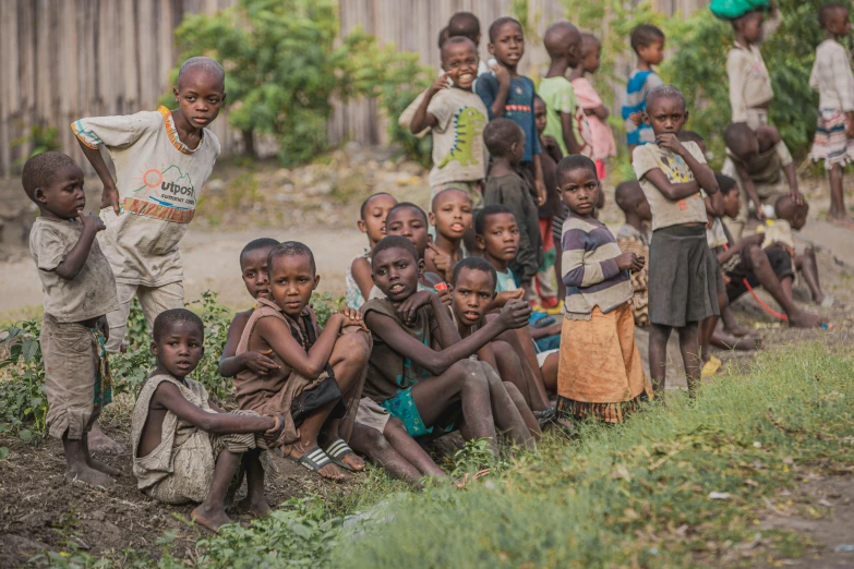 a group of small children are in a field