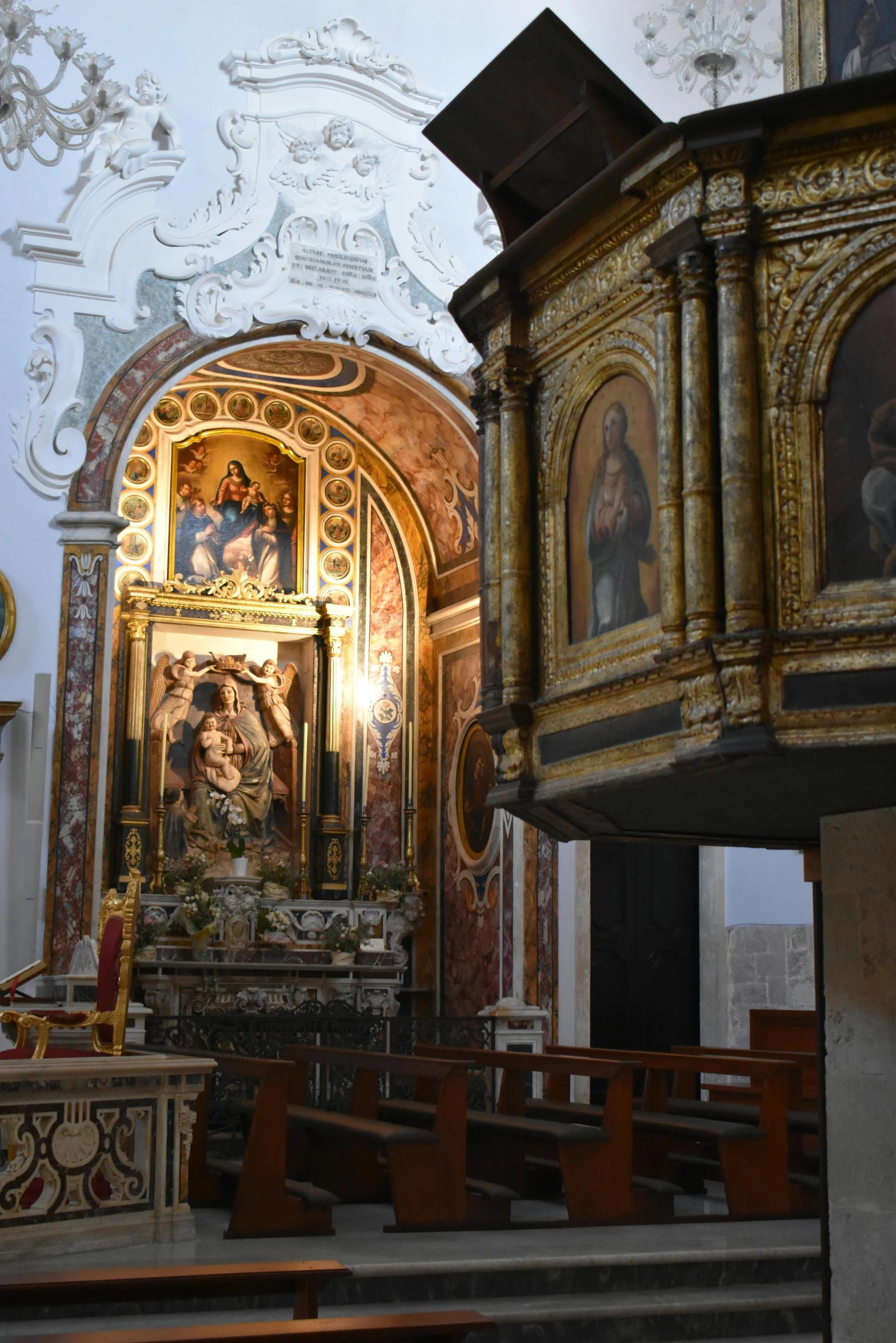 an ornate alter in a church with painting