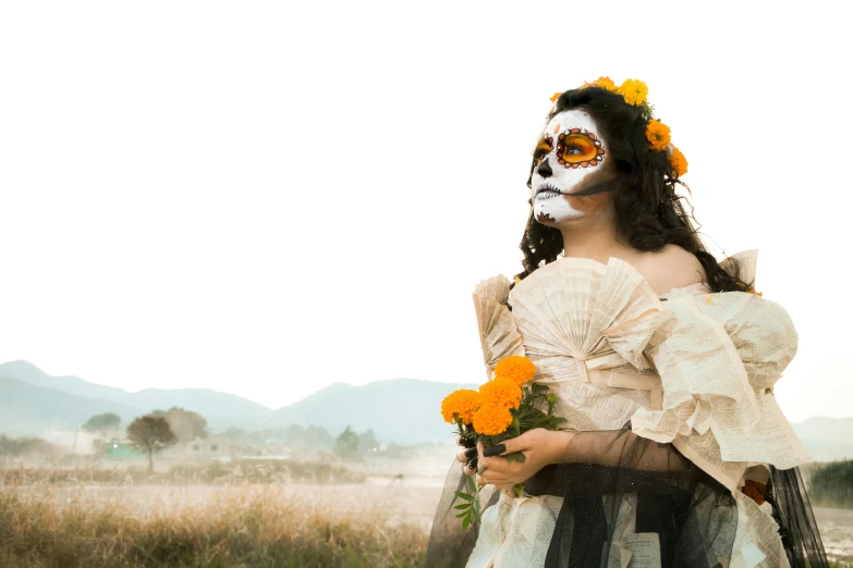 a woman with a face painted and flower wreaths