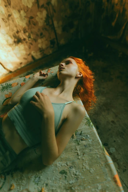 a woman laying on the floor with her eyes open