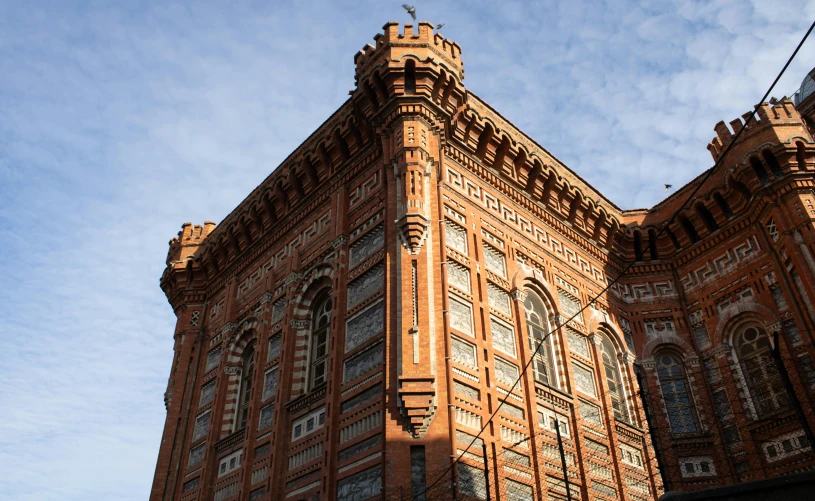 a tall building with a clock tower stands at the center of it