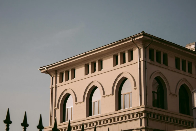 the building has many windows with fancy designs on it