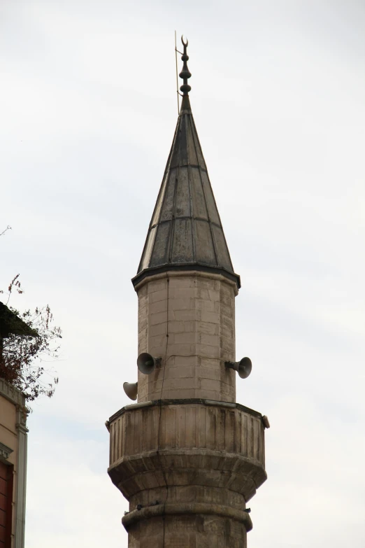 an ornate tower next to a building