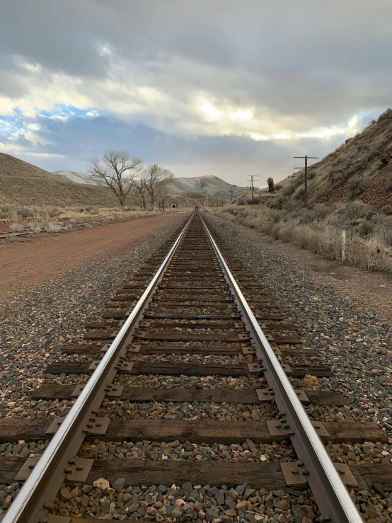 an old train track with some empty tracks