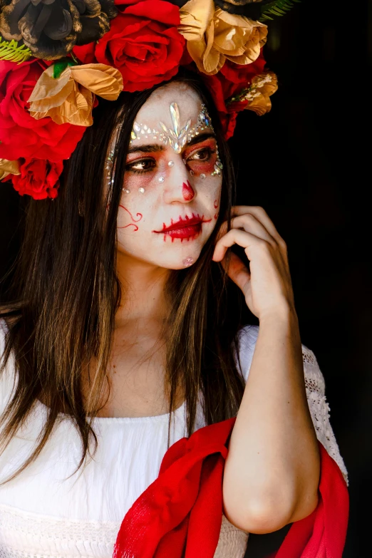 a woman dressed as a zombie for the day of the dead