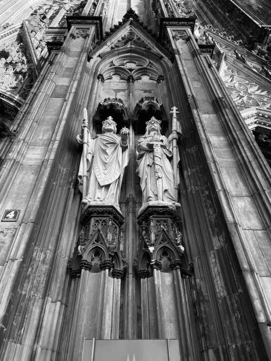 an old church with sculptures of women on it