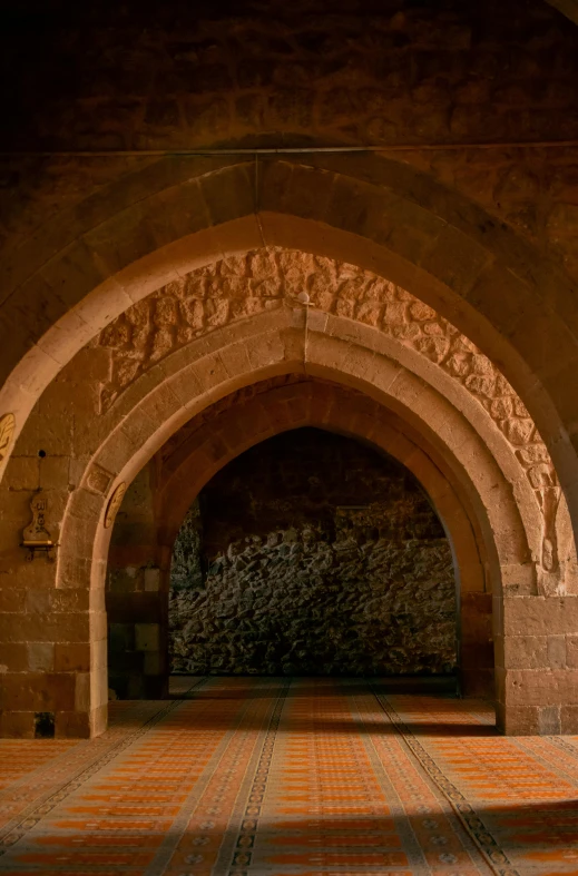 an arch is shown with a brick floor