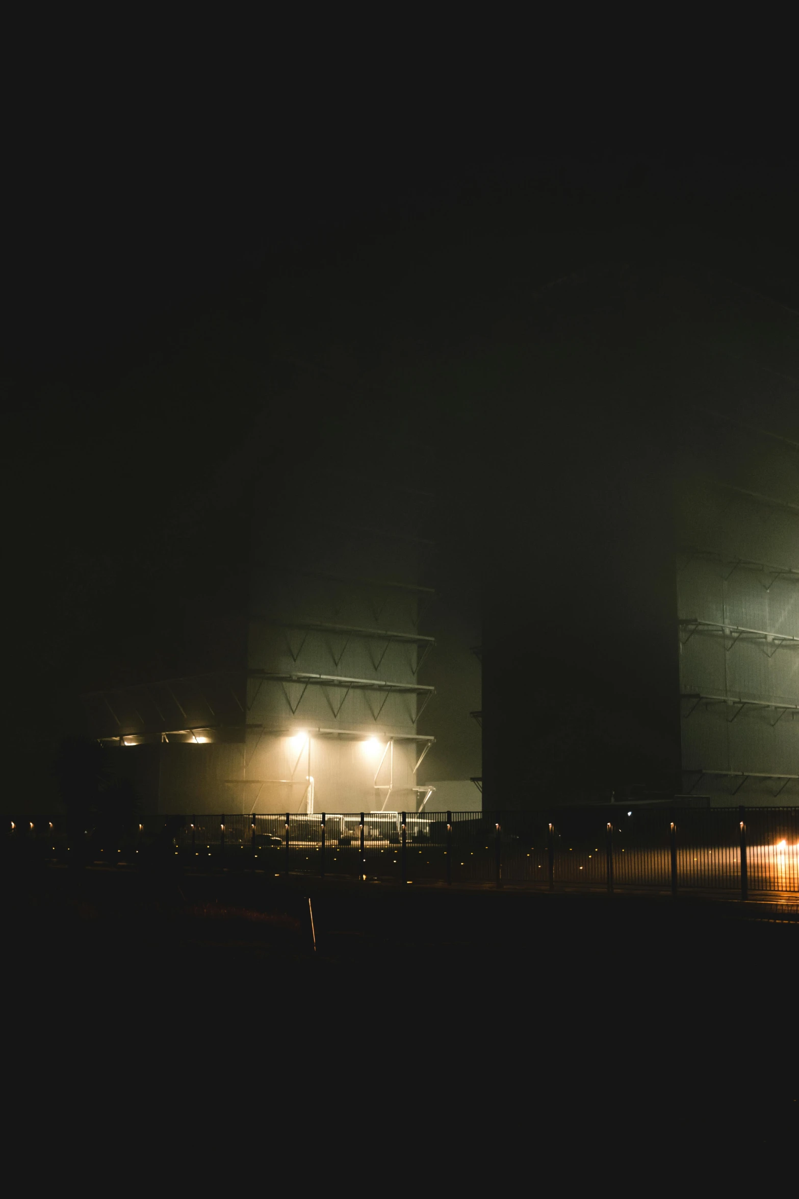 dark and fogy picture of some stadium lights