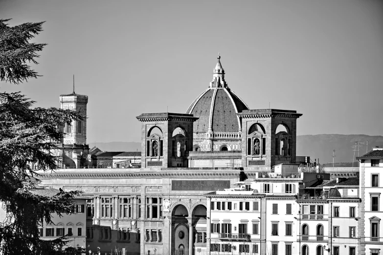 a large church steeple above some buildings