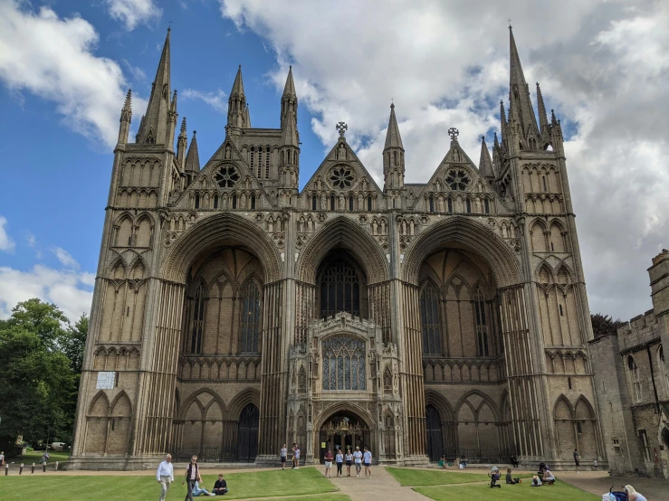 a large cathedral with spires and people