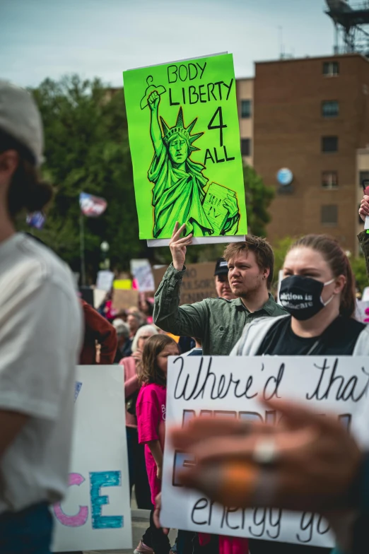 a group of people holding up signs with words