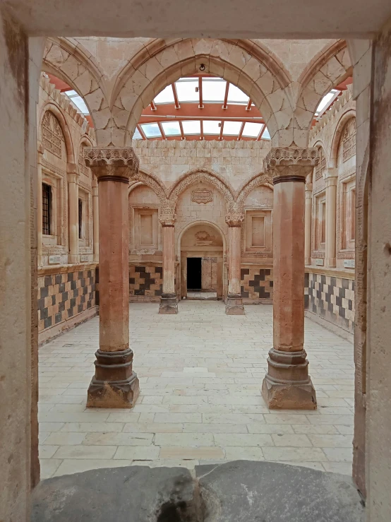 the inside of a large building with arches and archways