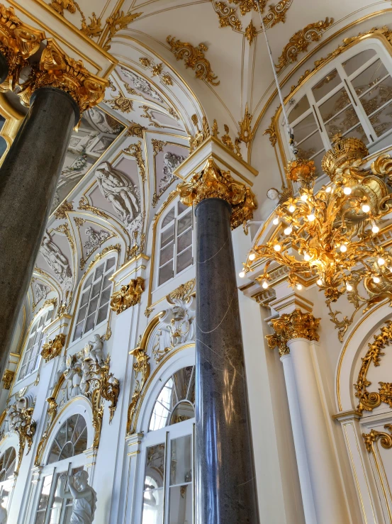 an ornate room with ornate gold trimmings and columns