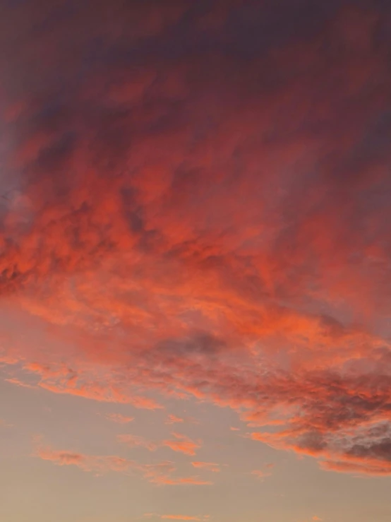 a po taken from the ground with a plane flying in the sky