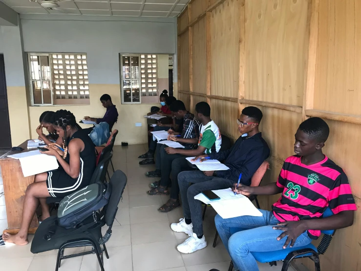 students in a classroom, sitting at their desks