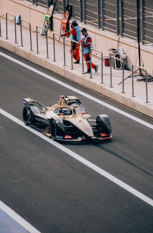 a person riding in a race car down a track