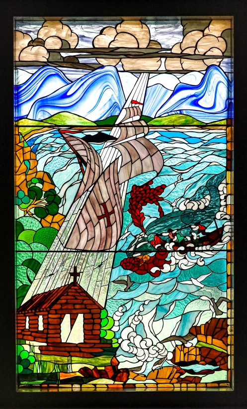 a ship sailing past a shore in a stained glass window